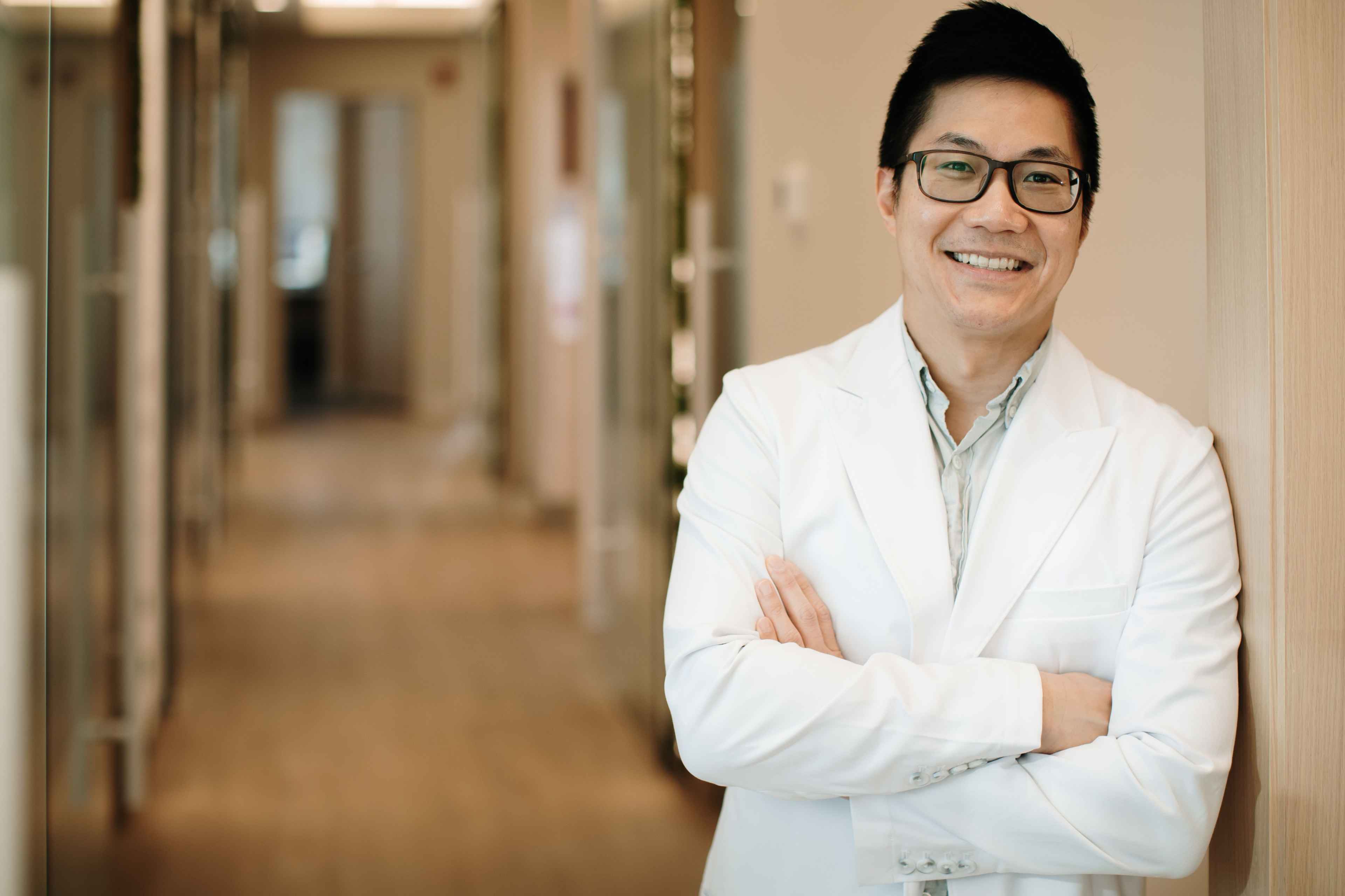 Dr. Ngai smiling and posing in Newbury Dental