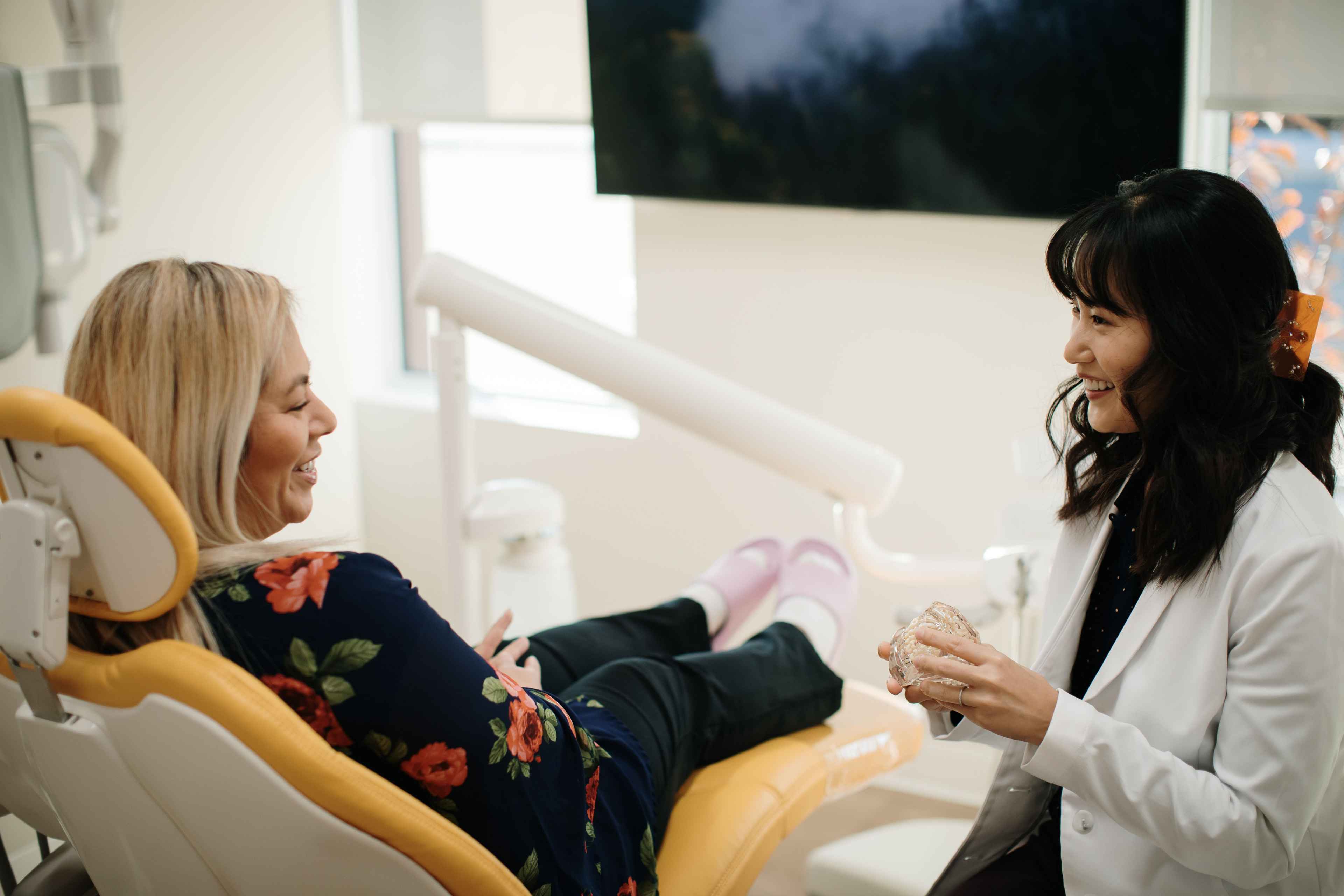 Dr. Linda Lee educating a patient on fillings