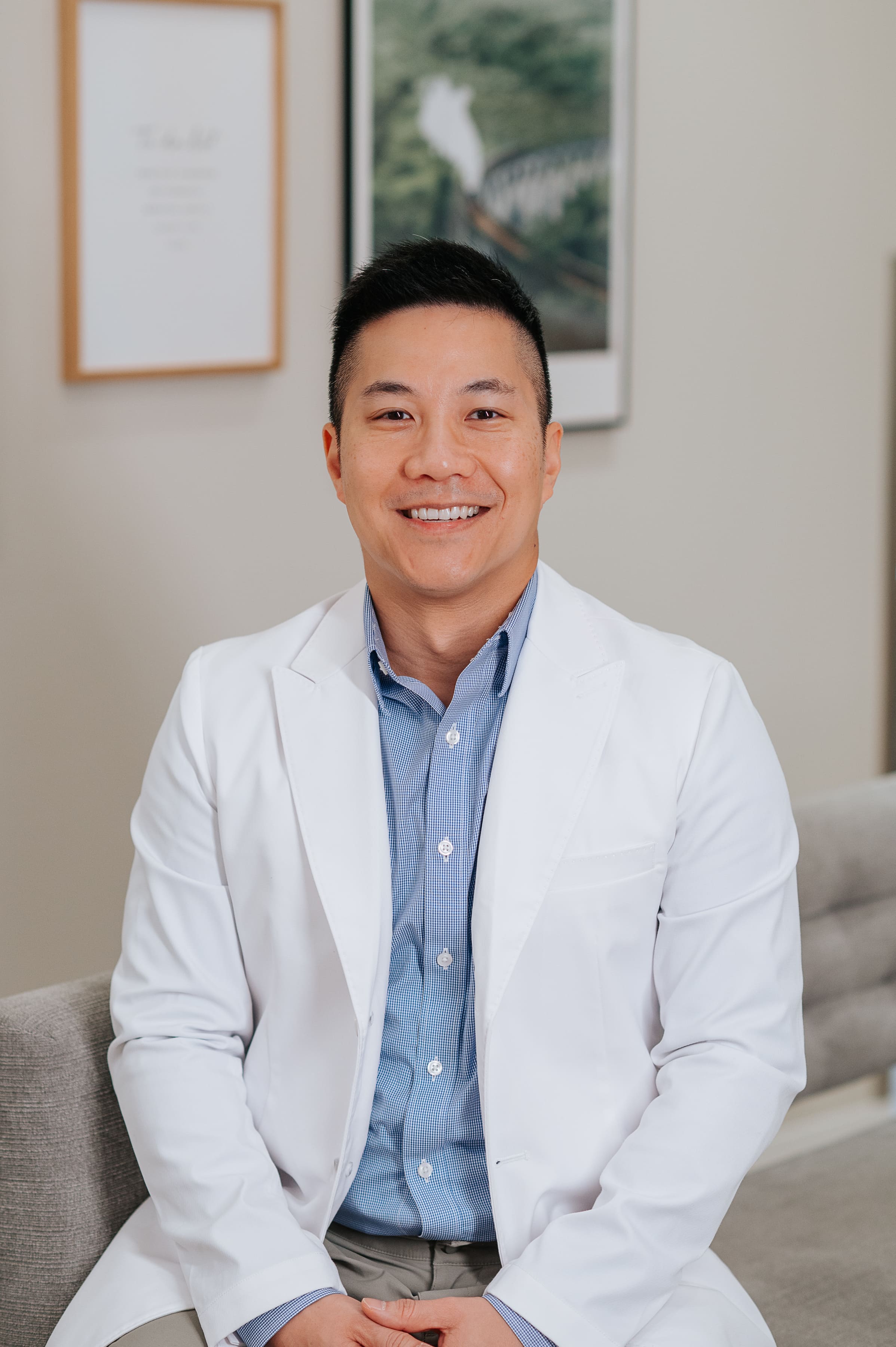 Dr. Ngai smiling and posing in Newbury Dental