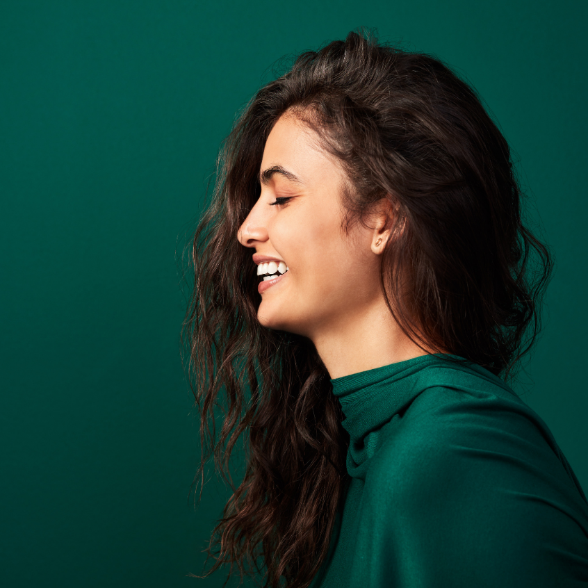 Women confidently smiling with gum contouring