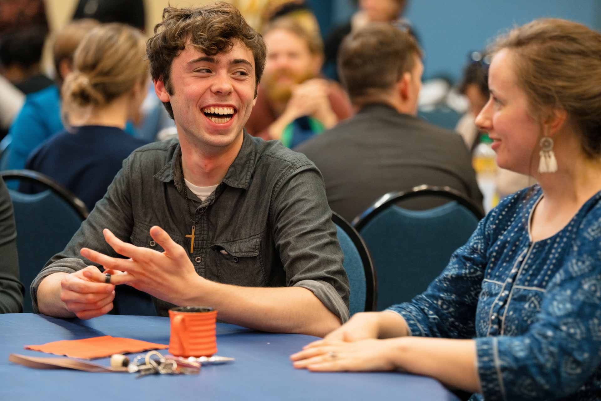 Attendees enjoying conversation at the Mission Expo Dinner at Trinity
