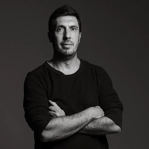 Black and white portrait of Dean Kelly, CEO of Gainful.