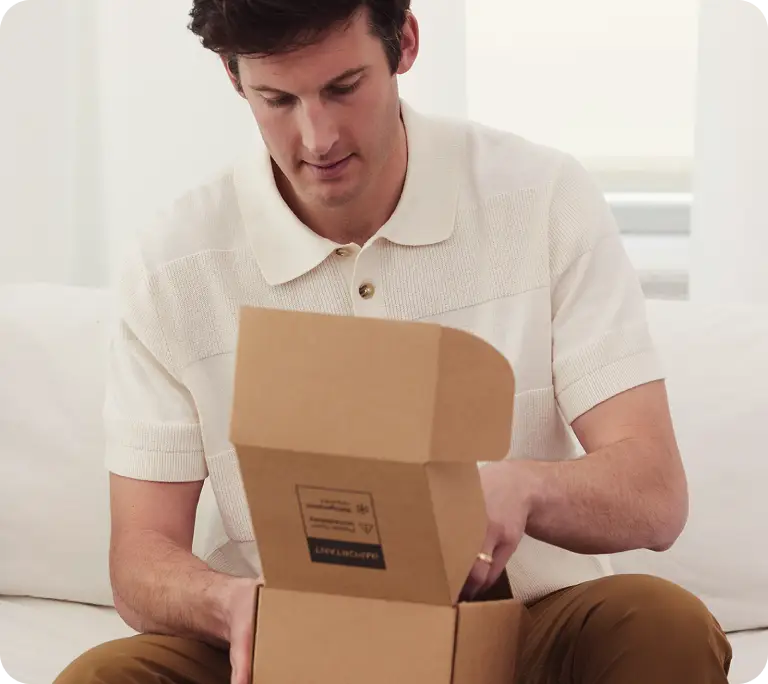 Gloved hand placing a vial into a cryostorage tank—secure, temperature-controlled sperm preservation using liquid nitrogen