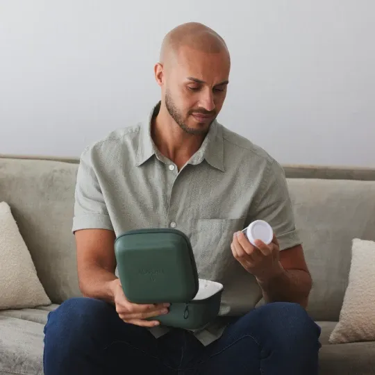 Man opening Legacy at-home sperm testing kit