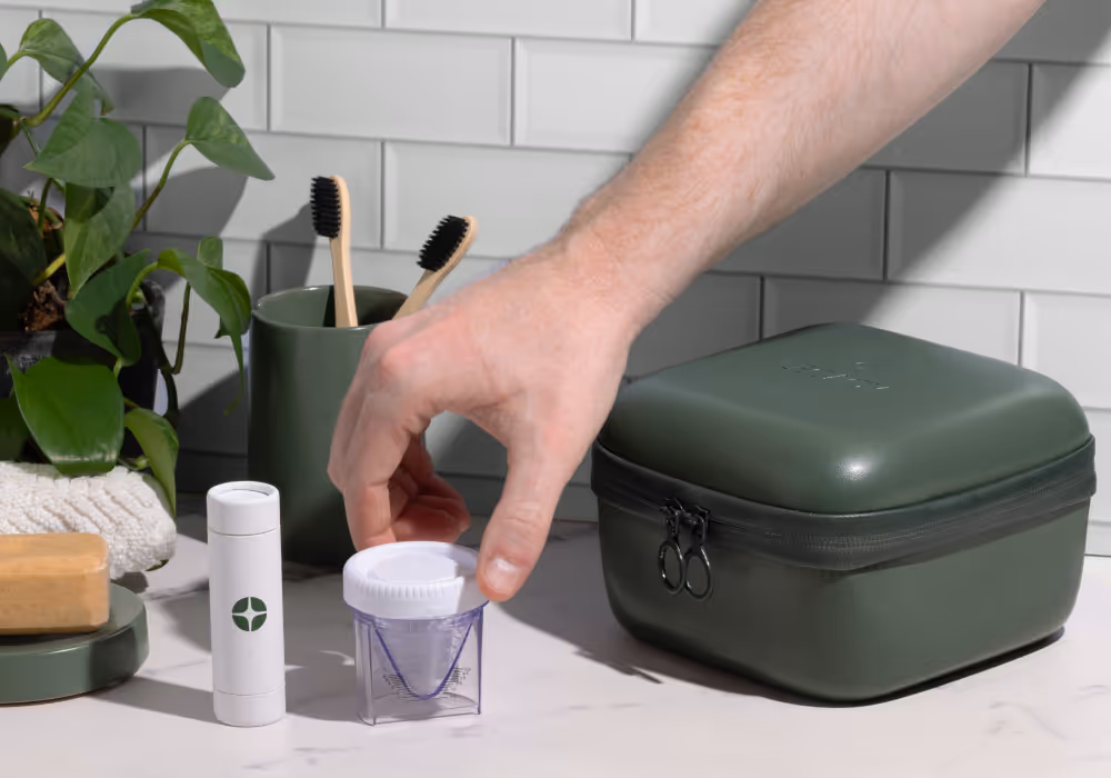 Trans woman smiling while opening a Legacy collection kit