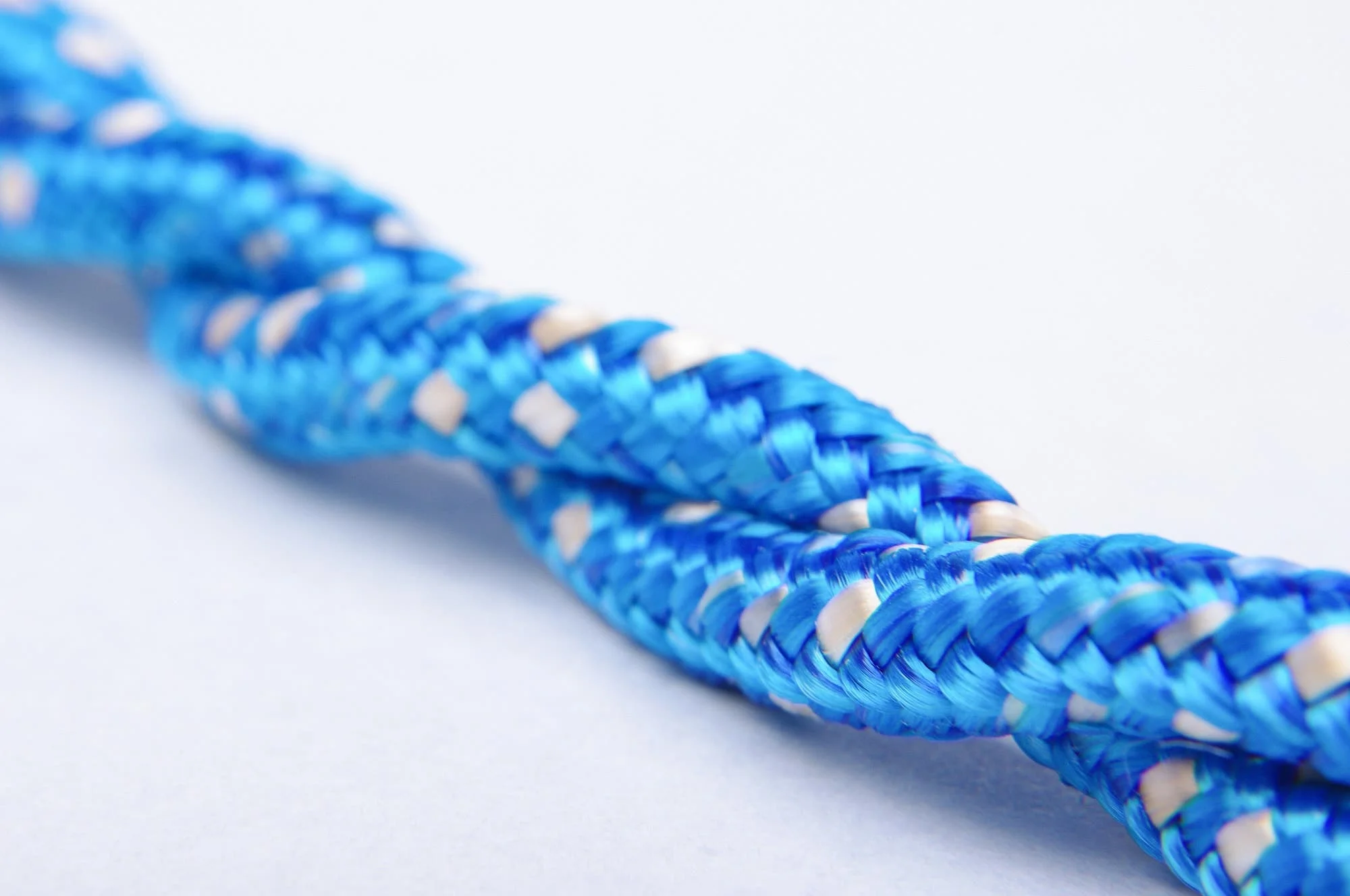 Blue twisted rope isolated representing testicular torsion