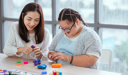 Autistic girl pursues a hobby of sculpting and painting.