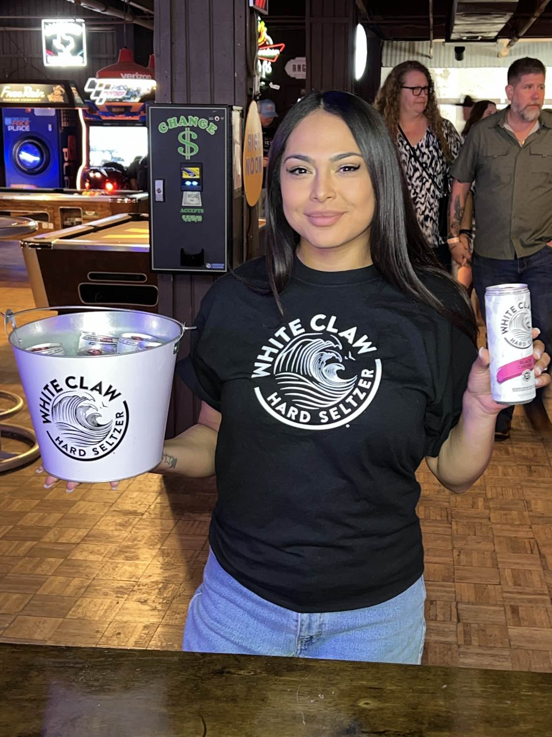 White Claw brand ambassador engaging consumers at retail event