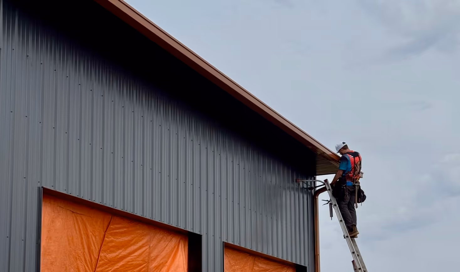 a copper colored box gutter on a commercial building