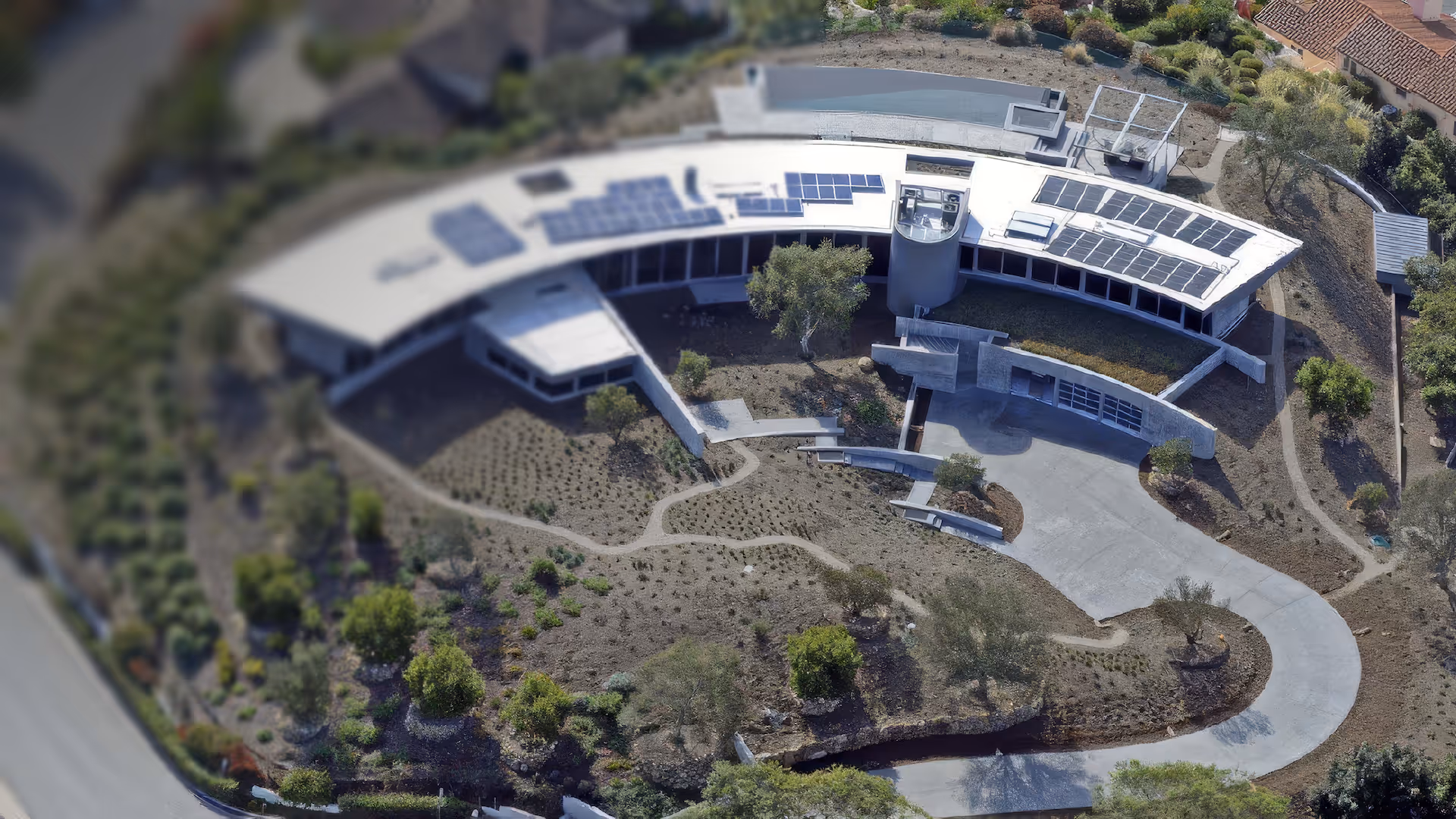 Luxury hillside home with custom-installed solar panels and backup energy systems by Totally Wired Electric, serving Southern California estates.