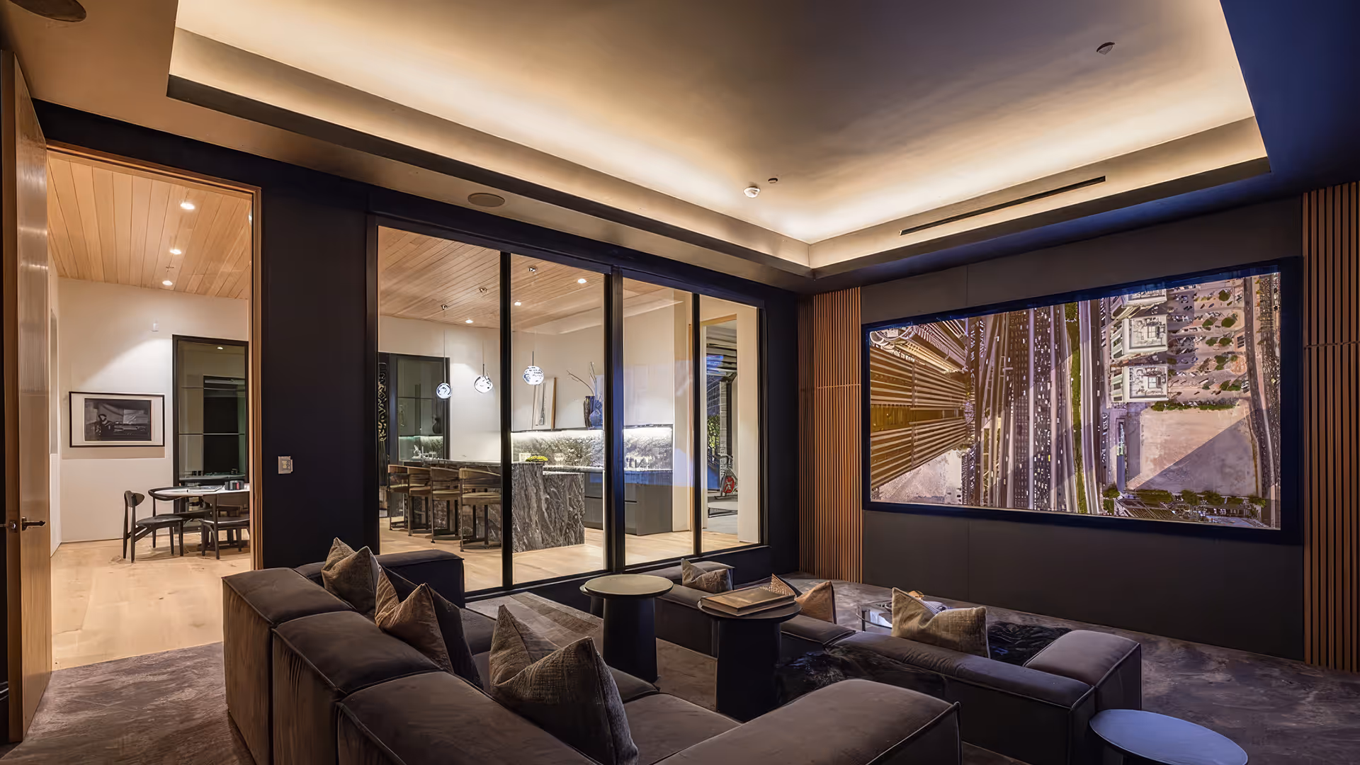 Luxury home theater installation with large wall-mounted screen, smart lighting, and custom AV design in Southern California estate.