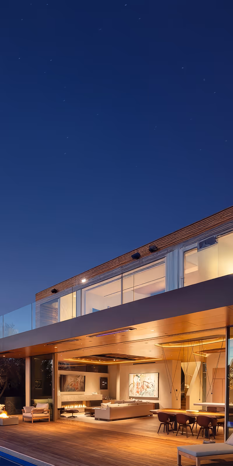 Modern Southern California luxury home with custom outdoor lighting, smart home automation, and entertainment systems installed by Totally Wired Electric.