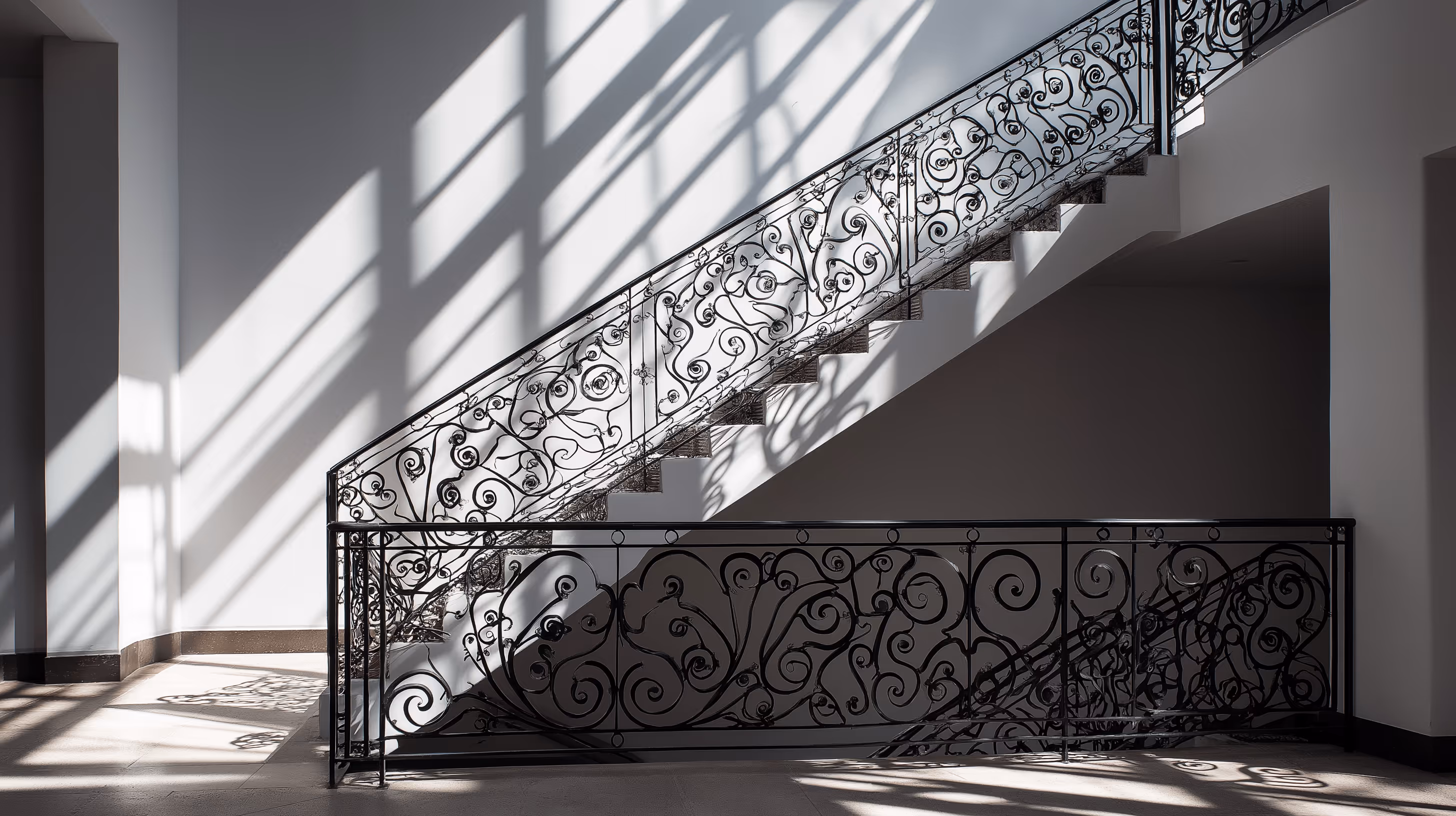 Ornamental iron stair railing with custom metal balusters