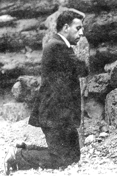 Saint Miguel Pro kneeling in the dirt.