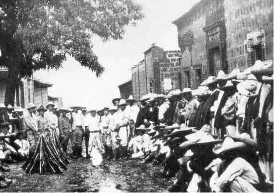 Catholic Cristeros standing in plaza.