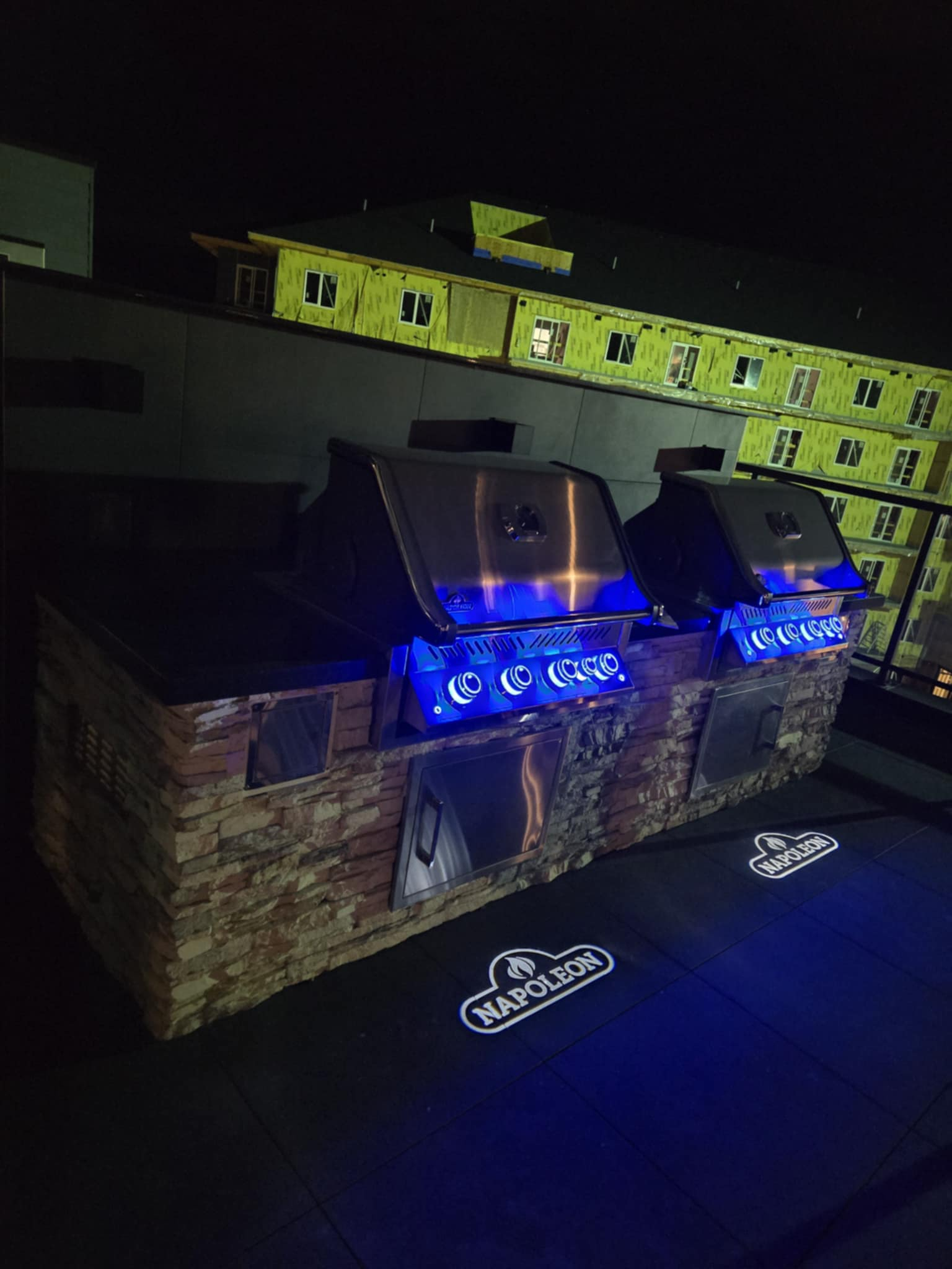 the barbecues projecting the brand name at night 