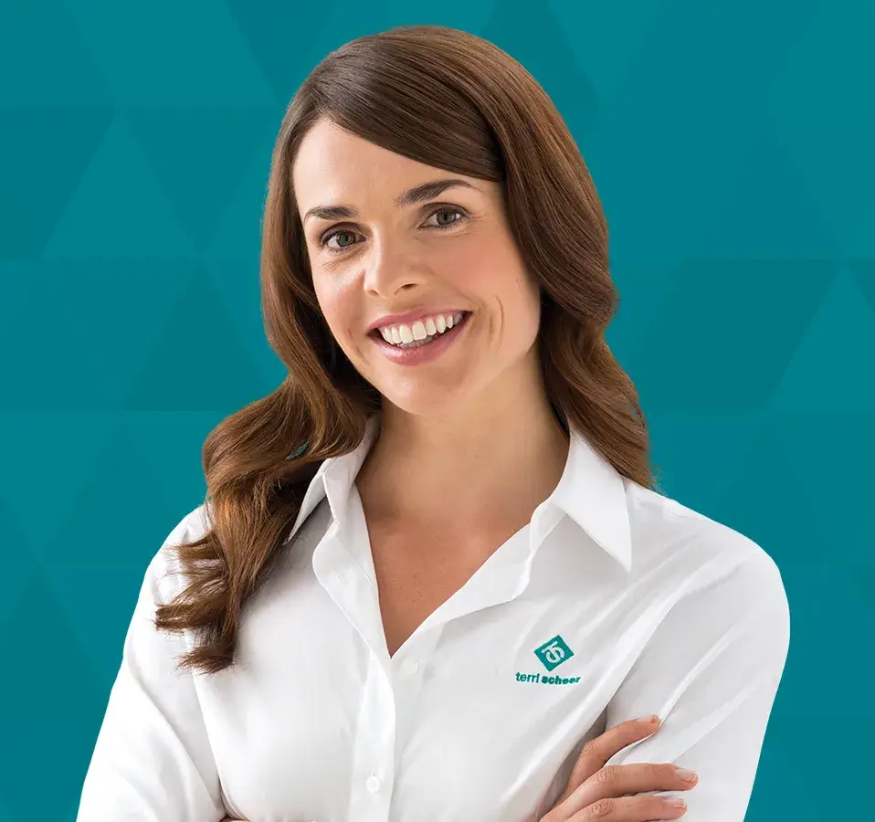 Terri Scheer woman in a branded shirt on teal background, featured in the Landlord Insurance TV commercials.