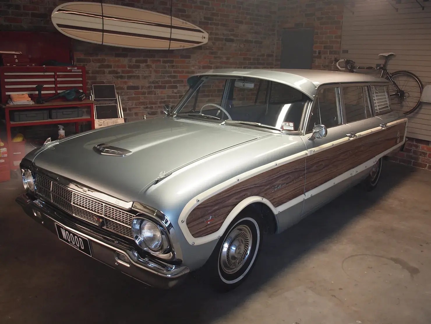 Classic Ford Falcon Squire station wagon parked in home garage, part of Shannons Insurance for Motoring Enthusiasts TV campaign.