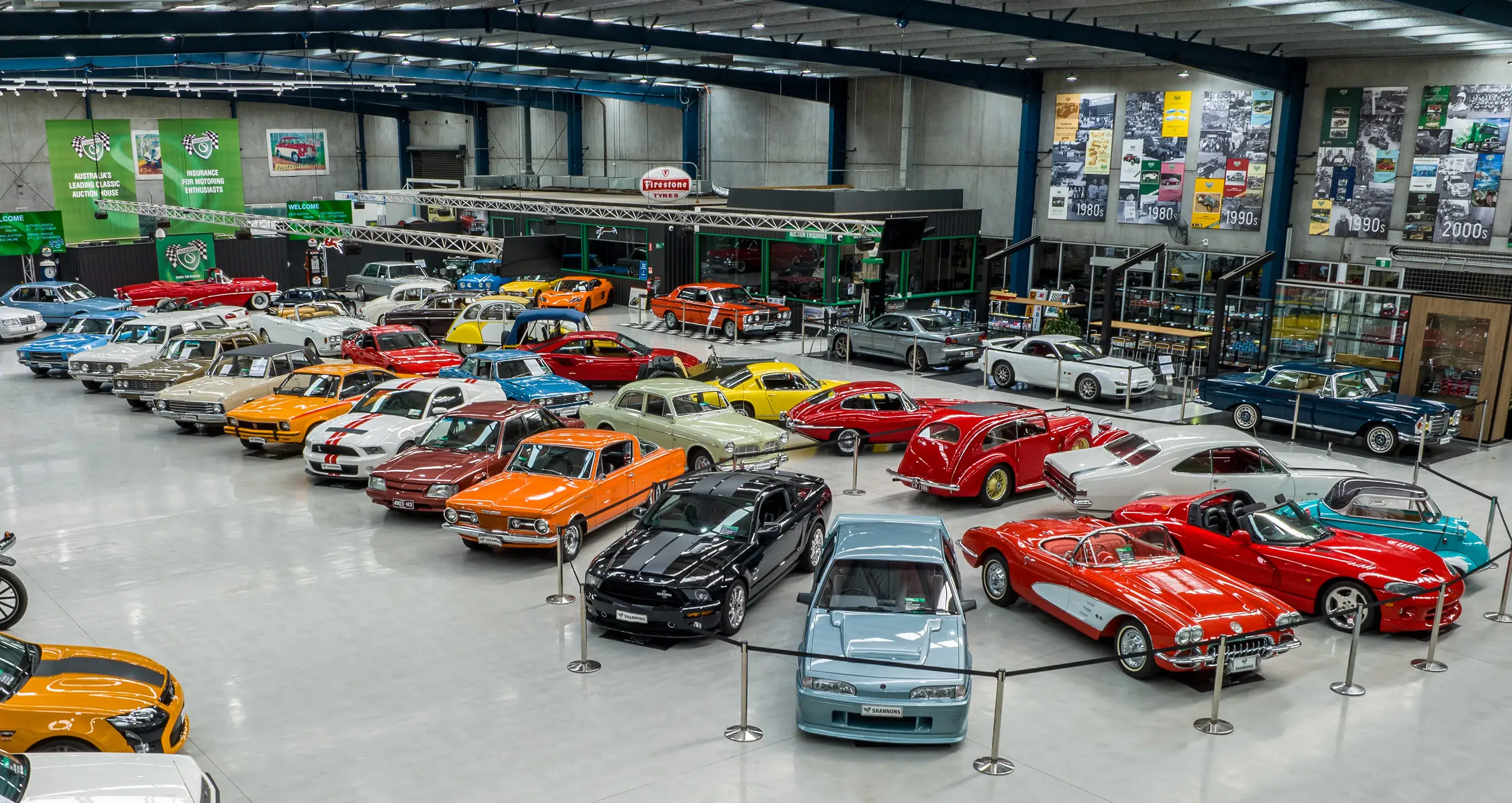 Shannons auction showroom filled with classic and collectible cars, showcasing the variety promoted as part of Shannons Auctions marketing.