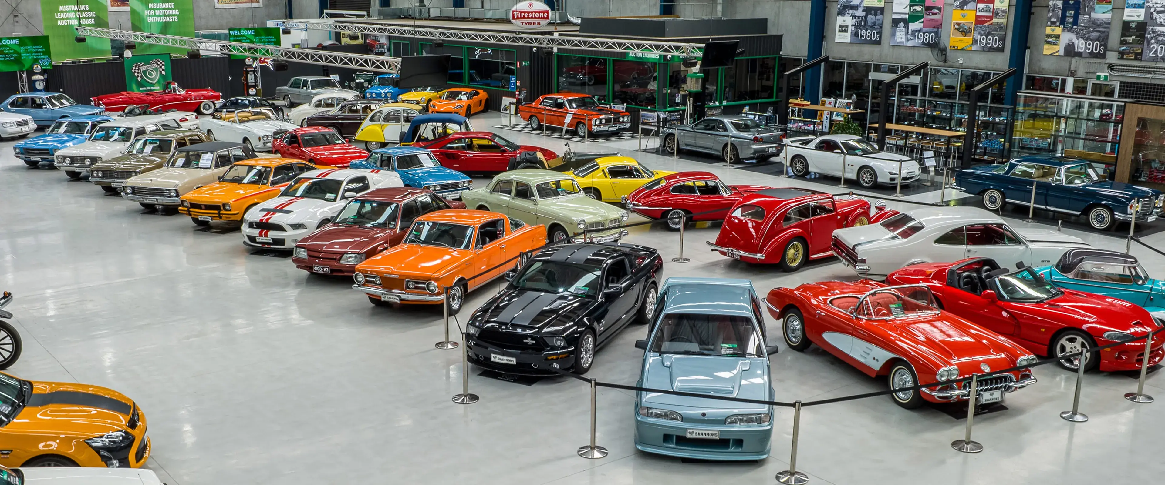 Shannons auction showroom filled with classic and collectible cars, showcasing the variety promoted as part of Shannons Auctions marketing.