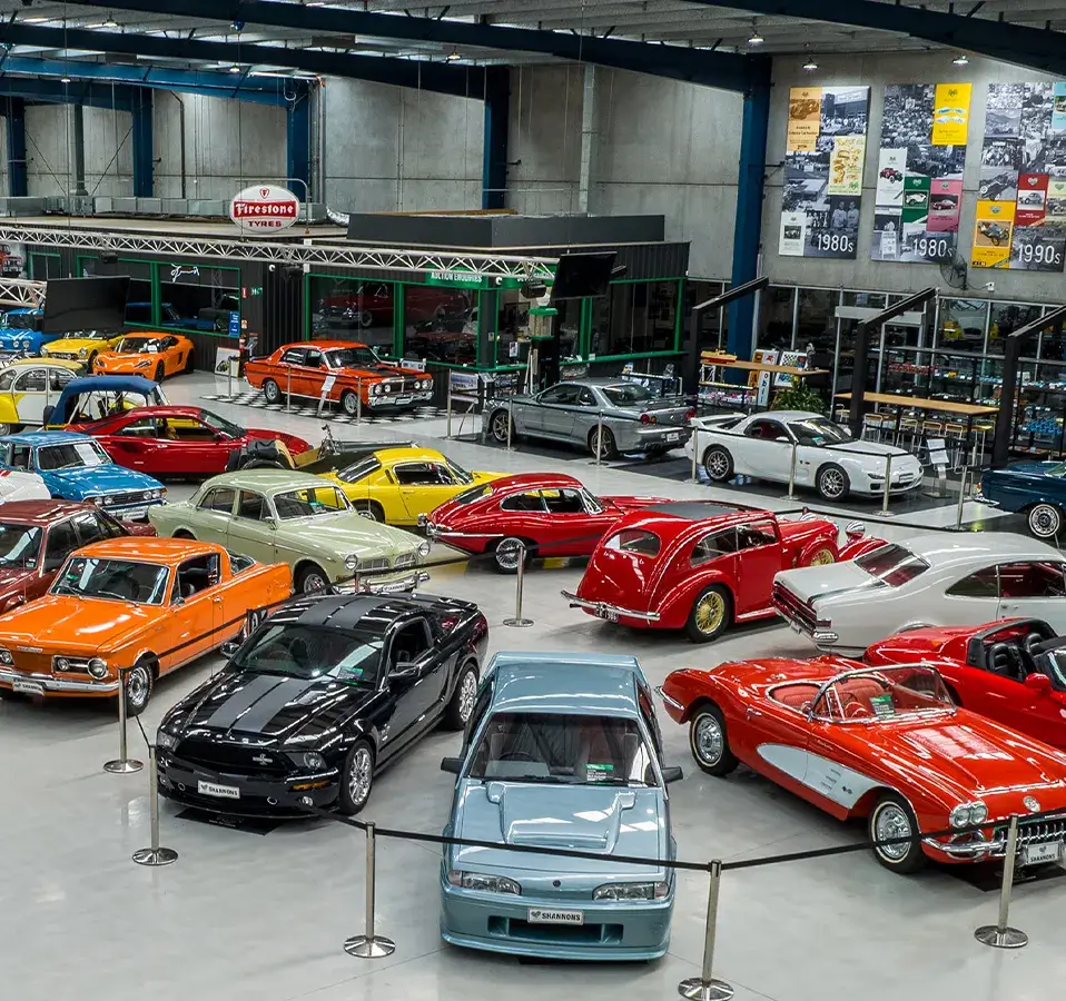 Shannons auction showroom filled with classic and collectible cars, showcasing the variety promoted as part of Shannons Auctions marketing.