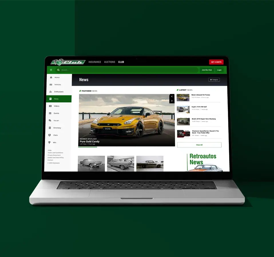 Laptop screen showing the Shannons Club News section with a feature article on a gold Nissan GT-R and links to other latest motoring news stories.