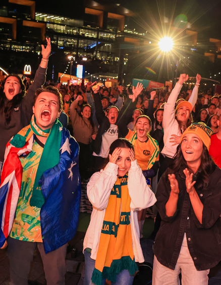 Matildas fans celebrate victory at the Sydney FIFA Fan Festival during the Matildas FIFA World Cup Game, being played in Brisbane, on August 12, 2023 in Sydney, Australia.