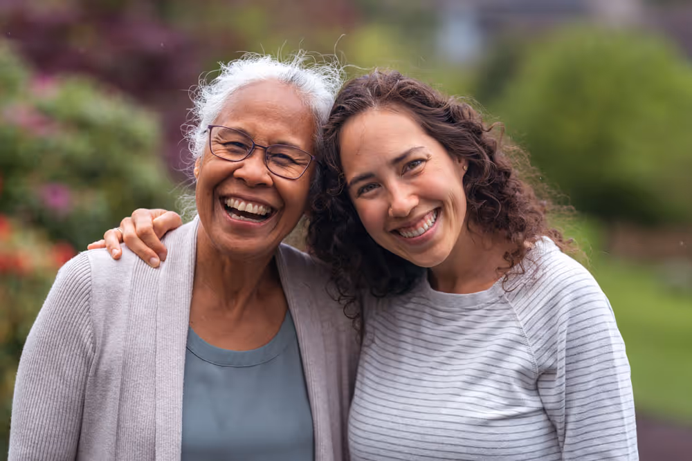 Two women embracing outdoors