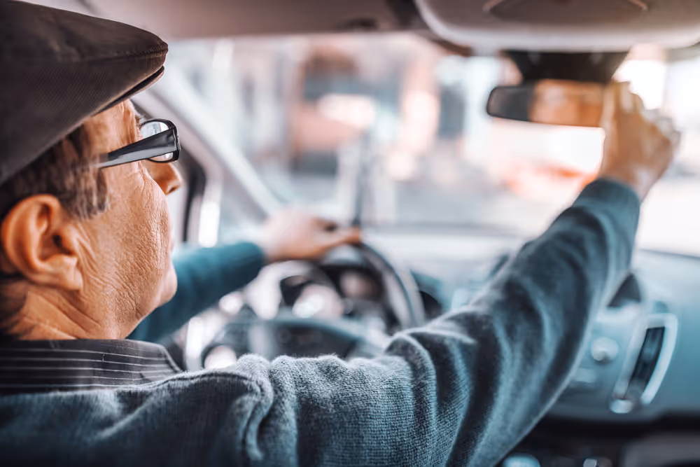 A man checking his rearview mirror