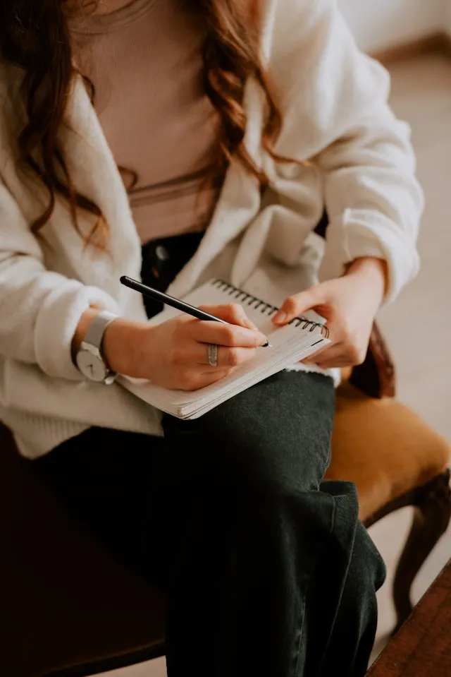 Female therapist taking notes