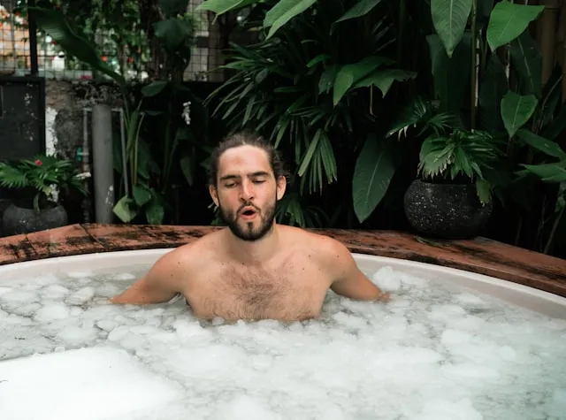Man in an at-home therapeutic ice bath