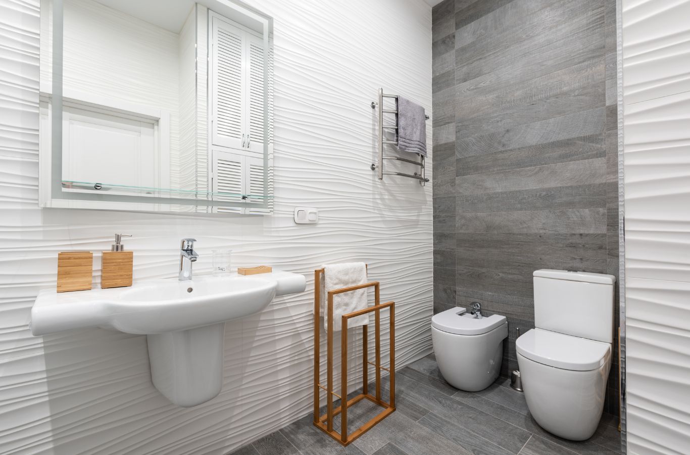 PMB Property Improvements team renovating a bathroom in Tampa, FL, installing modern fixtures and enhancing the space.