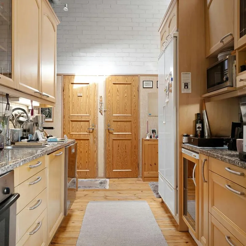 Image of new wooden kitchen cabinets installed by the PMG Property Improvements team