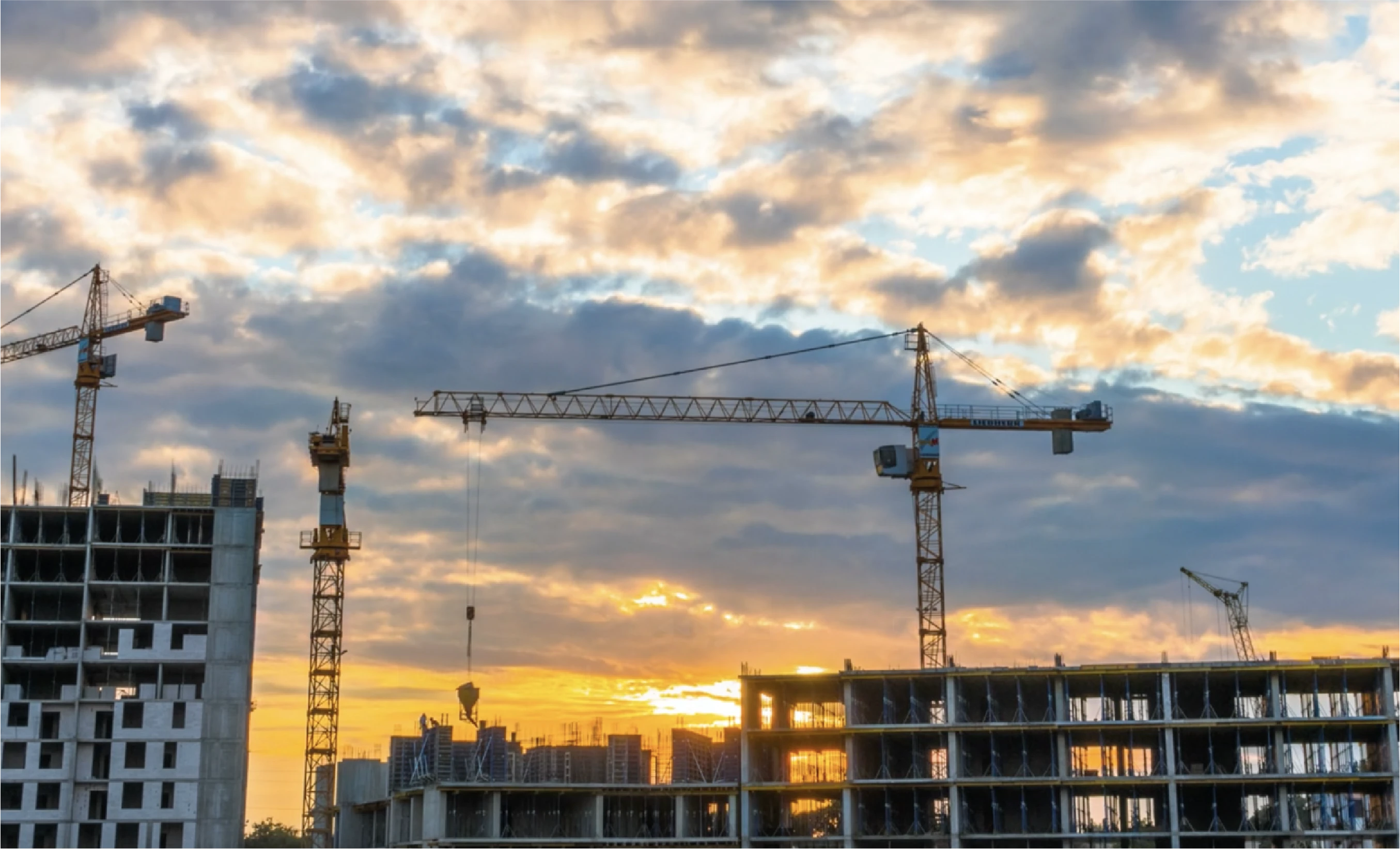 Construction project with sunset background