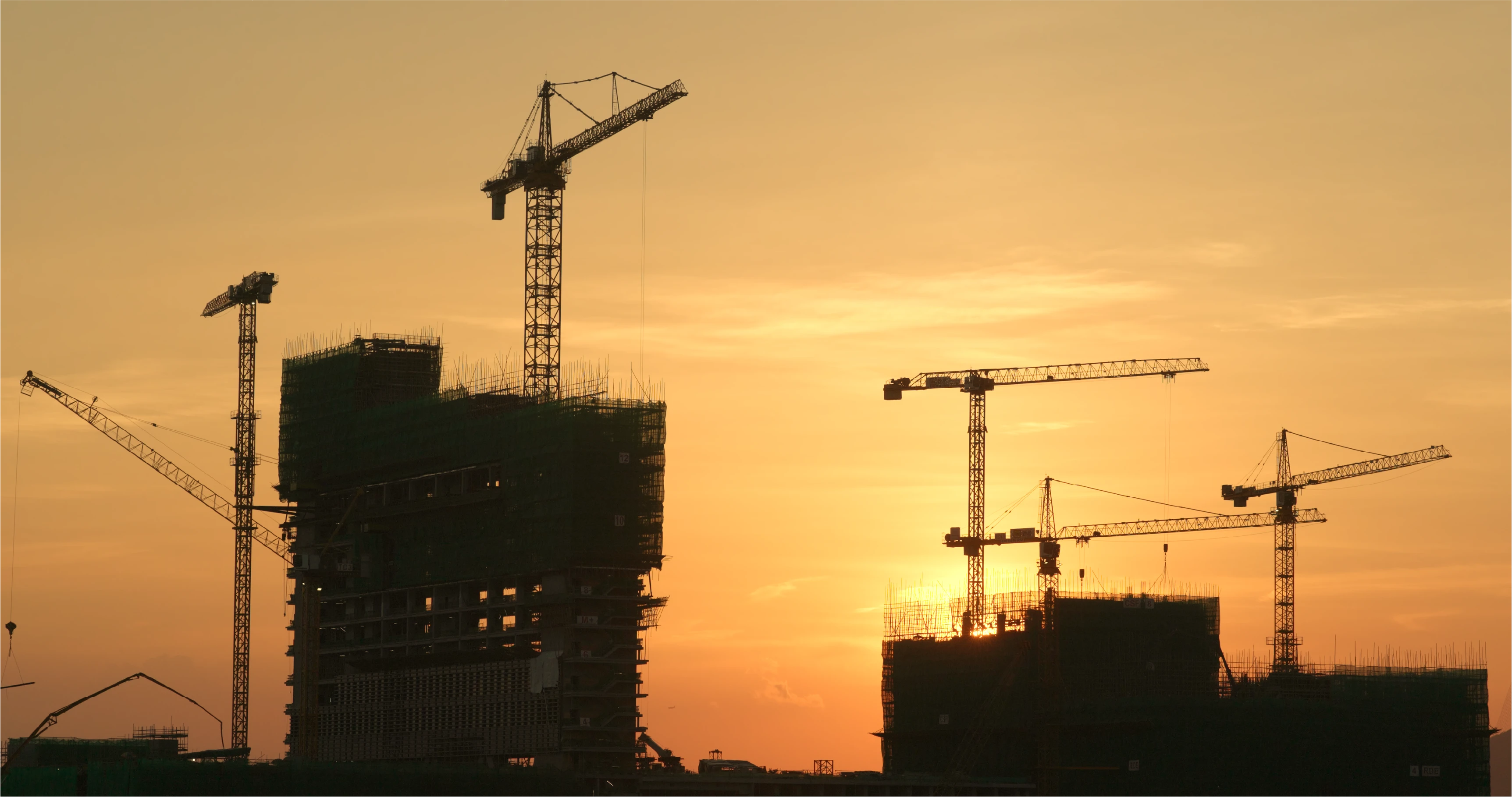 Construction site with sunset background