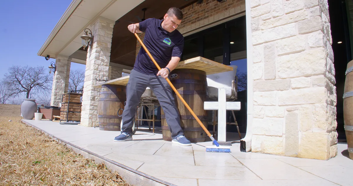 man cleaning tile