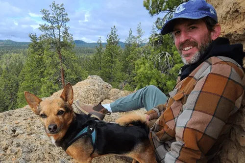 James Colestock, Business and Technical Advisor at Gringo Language Academy, seated on top of Wake Butte with one of the team dogs, Dooder, just outside of Bend, Oregon.