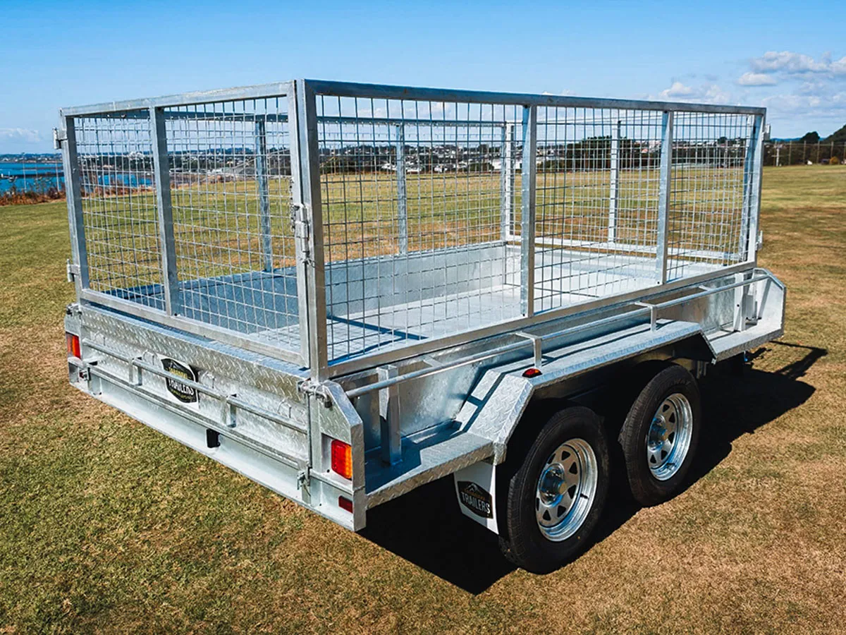 Silver metal utility trailer with mesh sides and dual wheels
