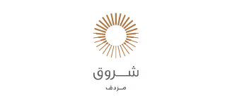 Stylized sun icon above Arabic text reading 'Shurooq Mubaid'.
