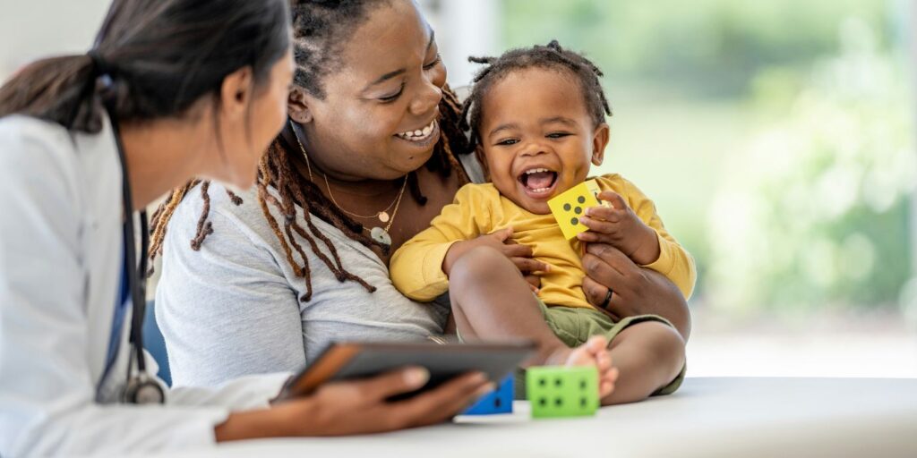 a woman and child with a health professional 