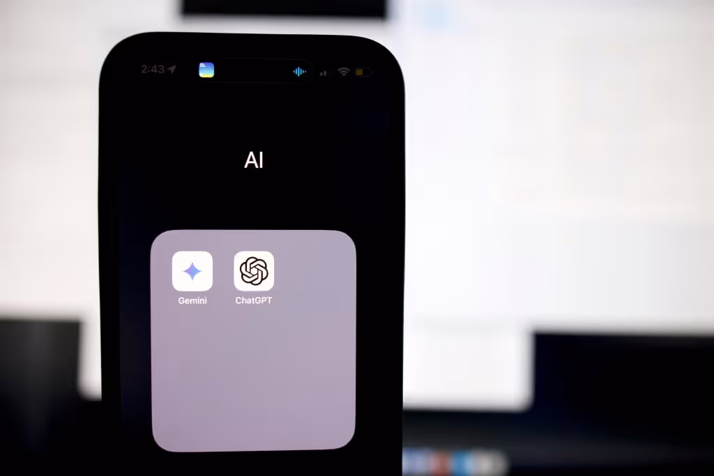 A close up of a mobile phone displaying AI apps on the screen.