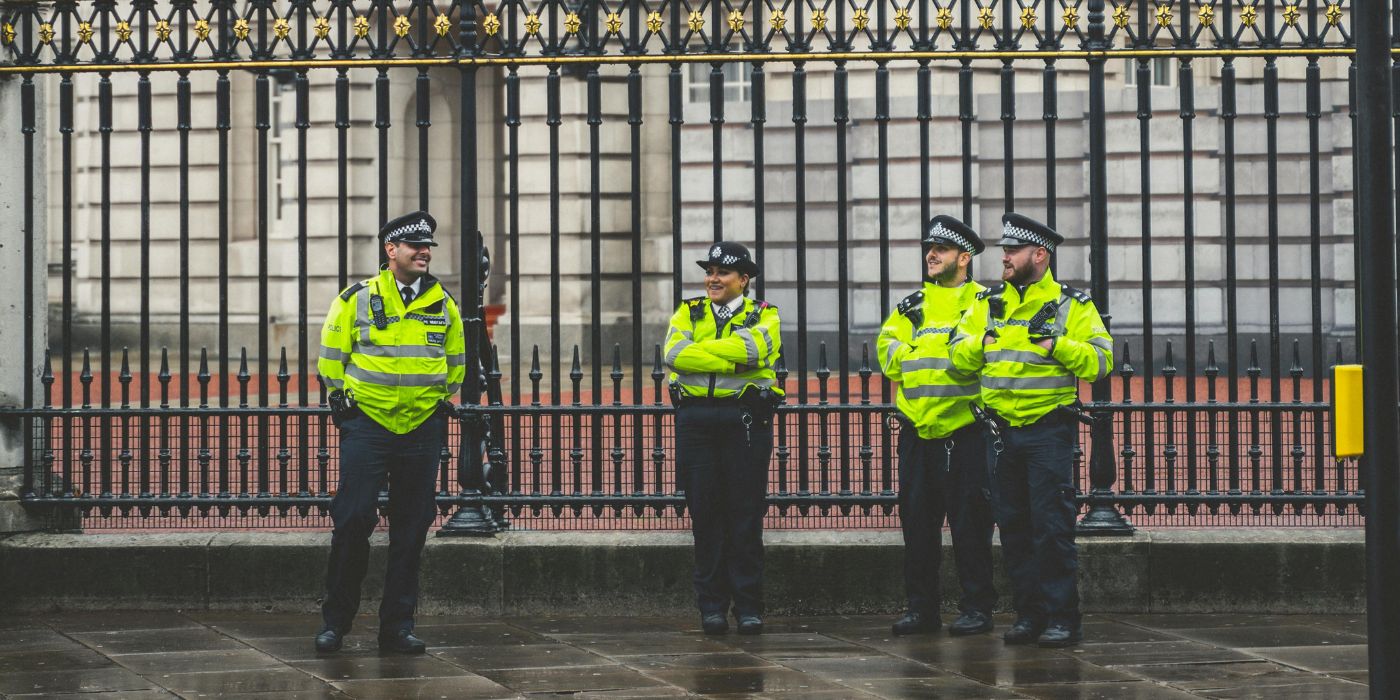 police positioned in front of a government building