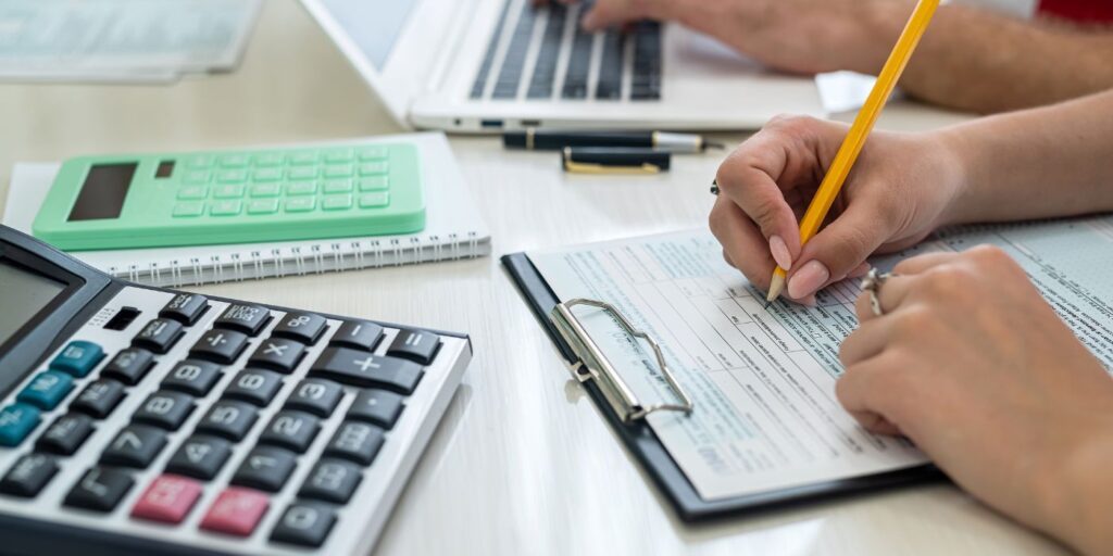 hand writing a form on desk for public consultation