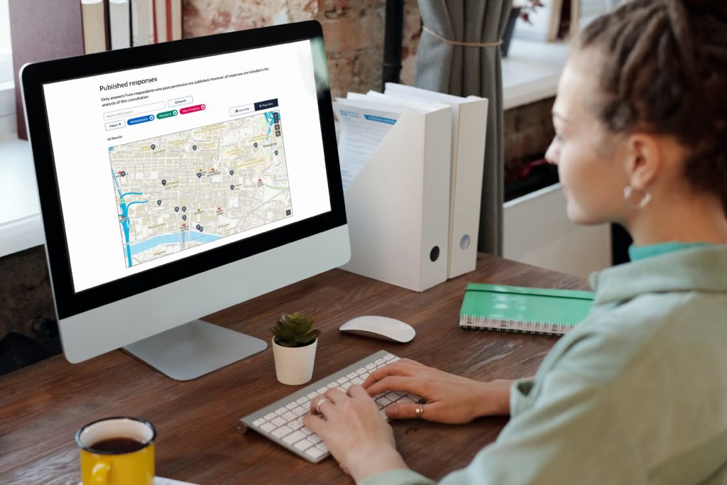 woman at computer participating in community engagement 