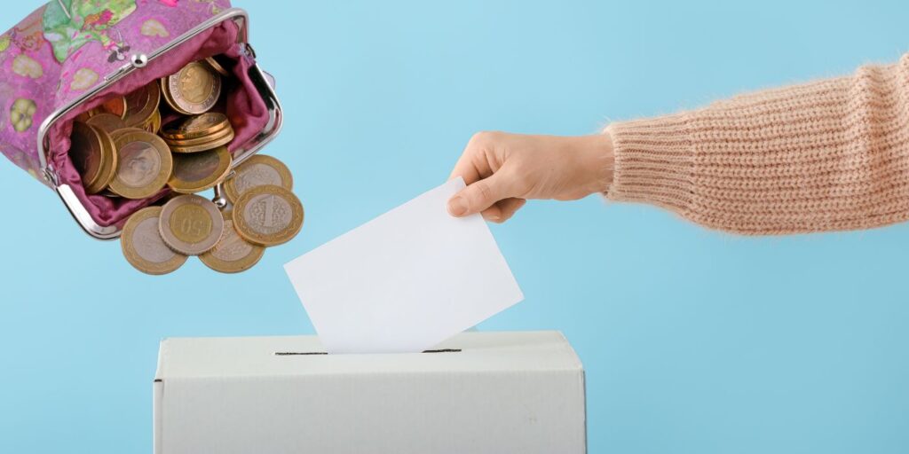 person placing ballot in box