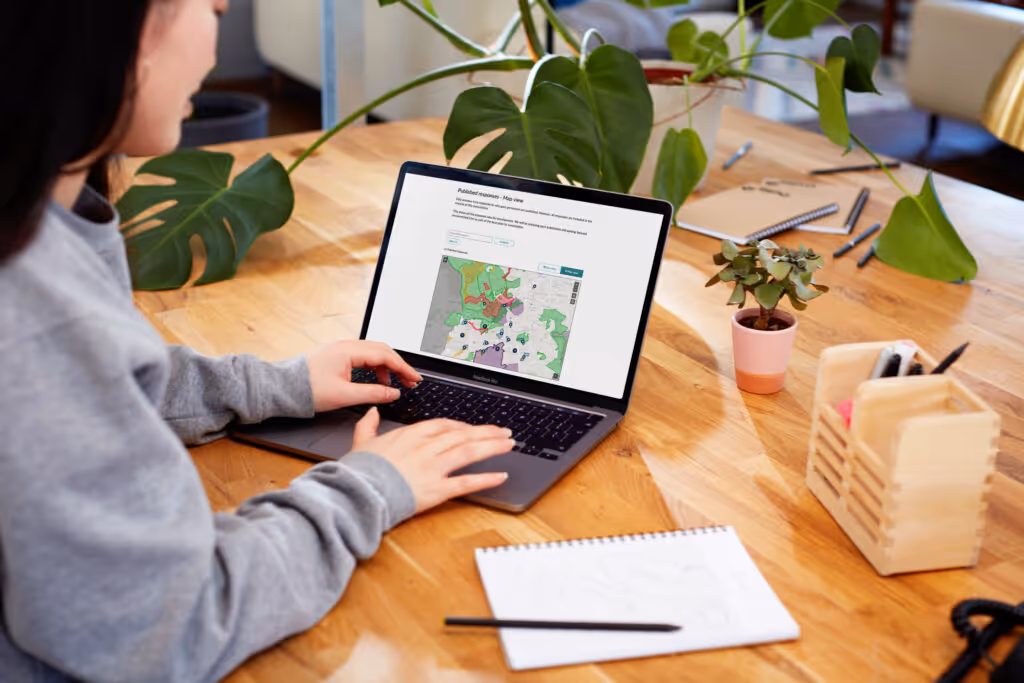 woman looking at CS Geospatial on laptop