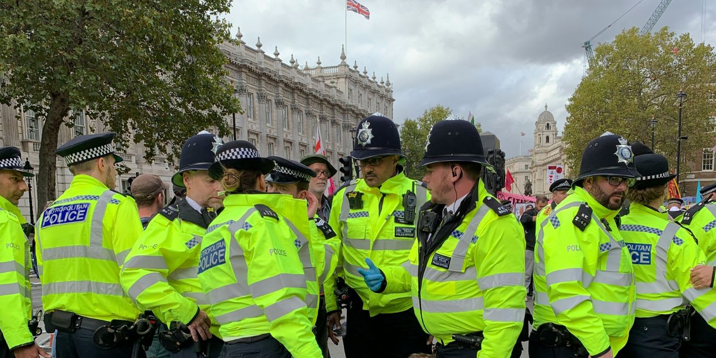 a group of police officers stand together