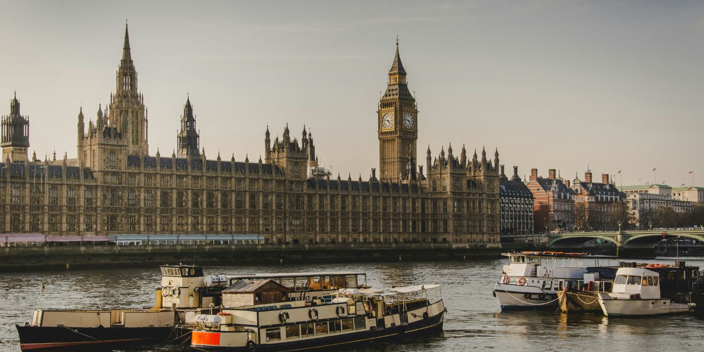 backdrop of central london with houses of parliament