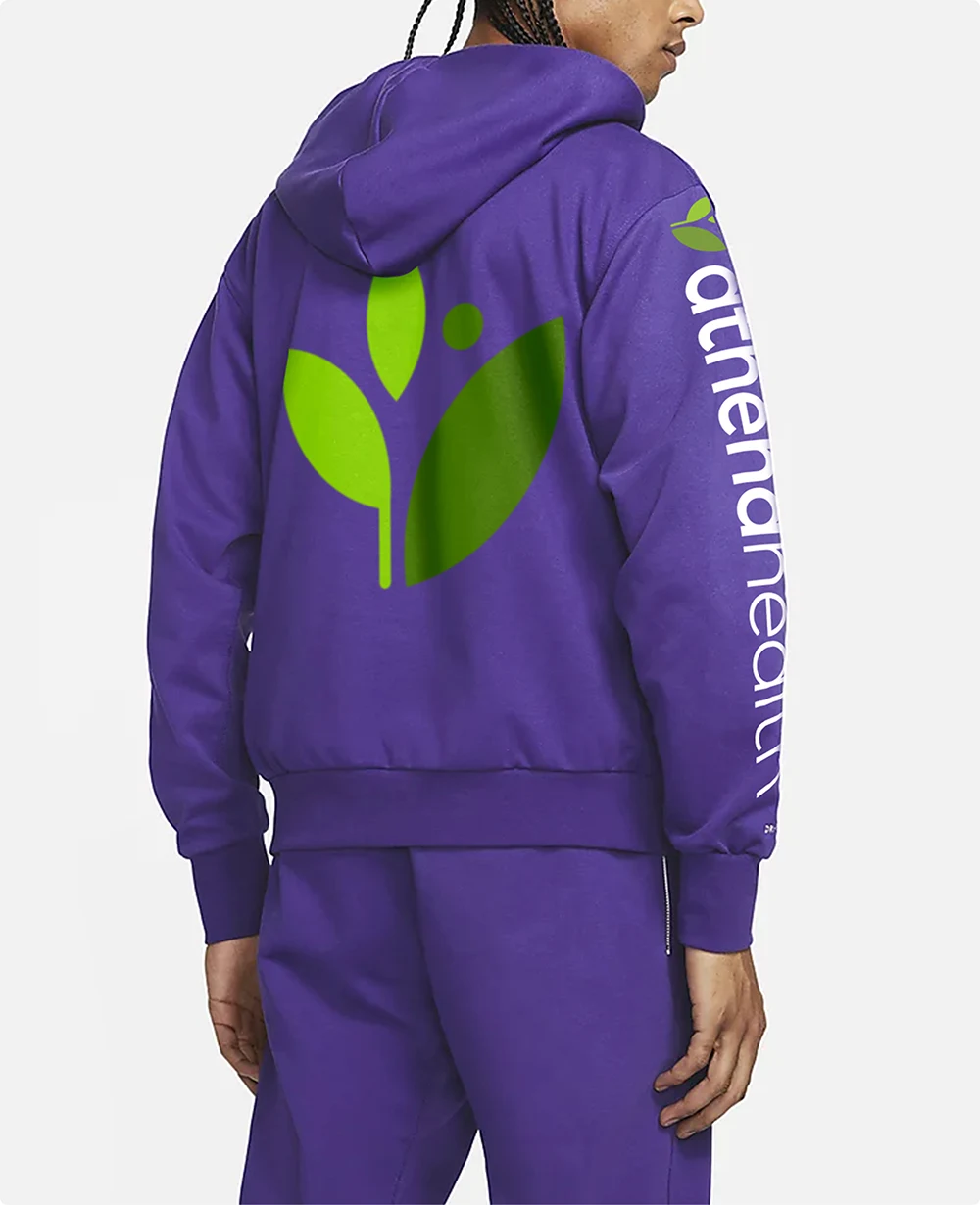 A purple jumpsuit with athenahealth branding. This apparel was design by Colossus as a part of athena's internal Employer Brand.