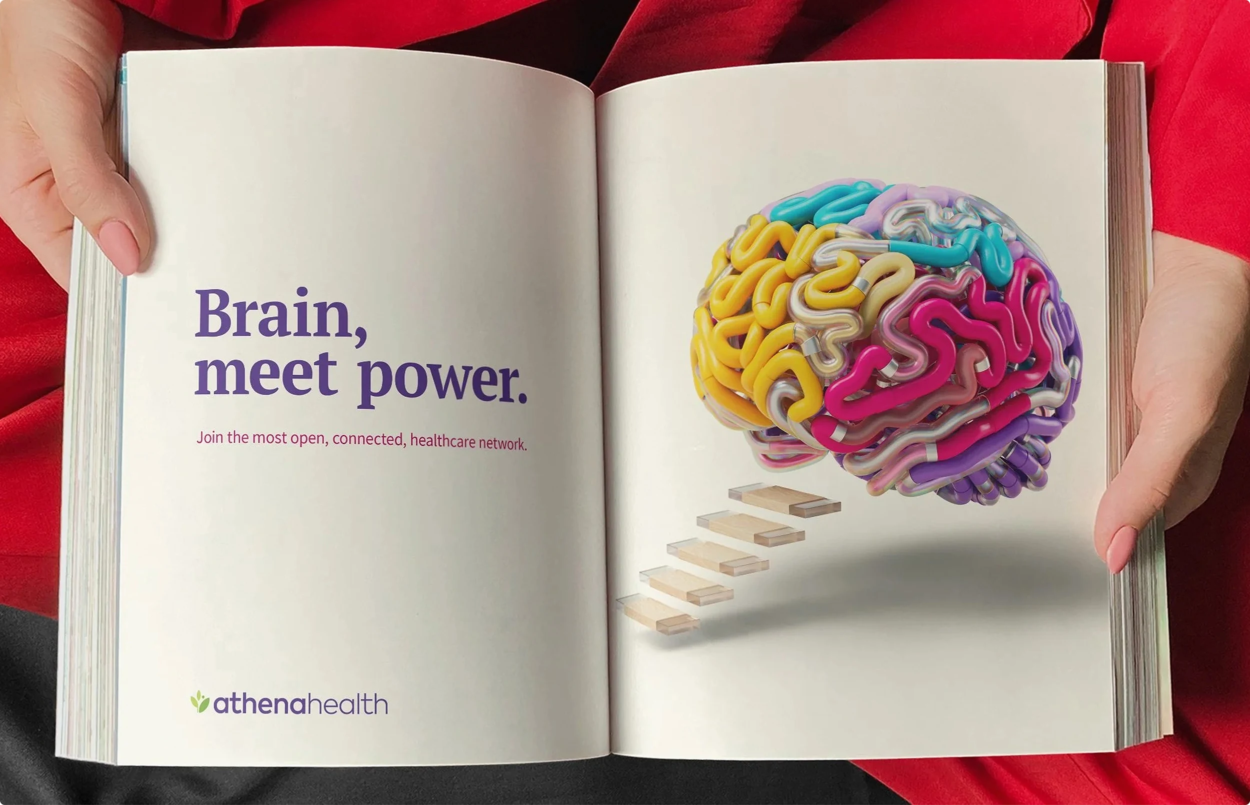 A full magazine spread advertisement for athenahealth. The headline reads "Brain, meet power." and features a futuristic brain with a staircase attached.